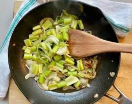 Sauteing onion and celery in a pot